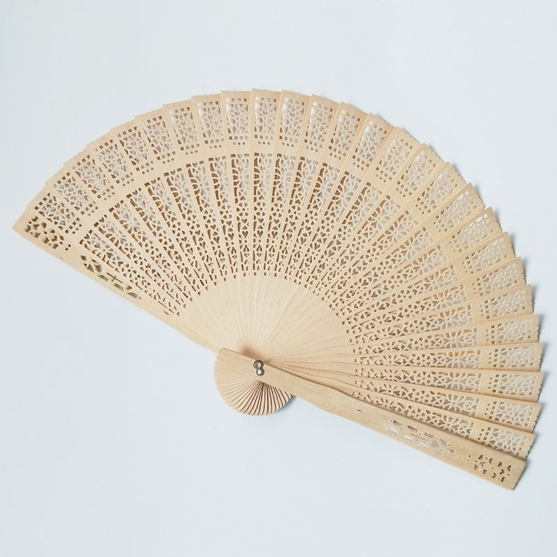 Siopsrl | Women's fan made of elegant, intricately perforated material Siopsrl