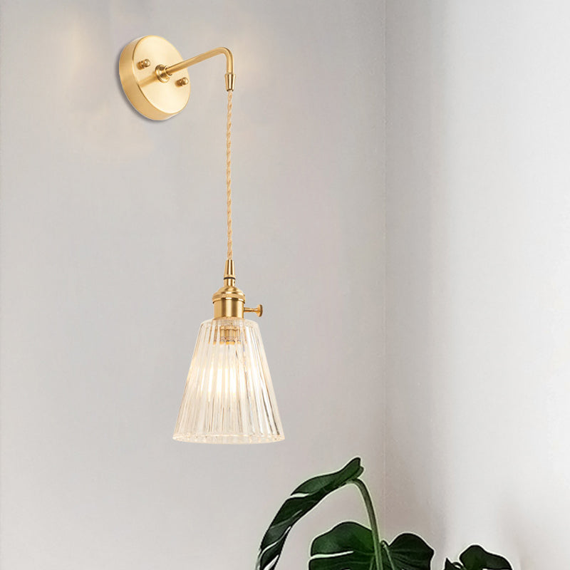 Siopsrl| A wall light with a bulb and conical shade made of clear, textured glass, industrial bedroom wall light fixture