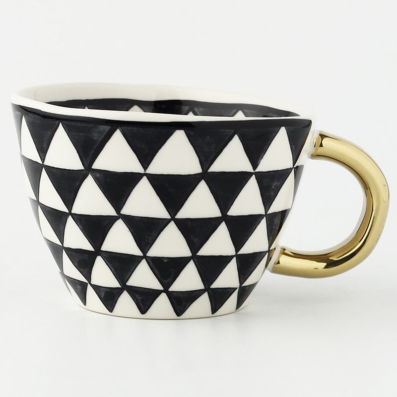 Siopsrl| Cup with abstract geometric pattern and gold handle