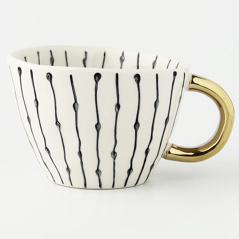 Siopsrl| Cup with abstract geometric pattern and gold handle
