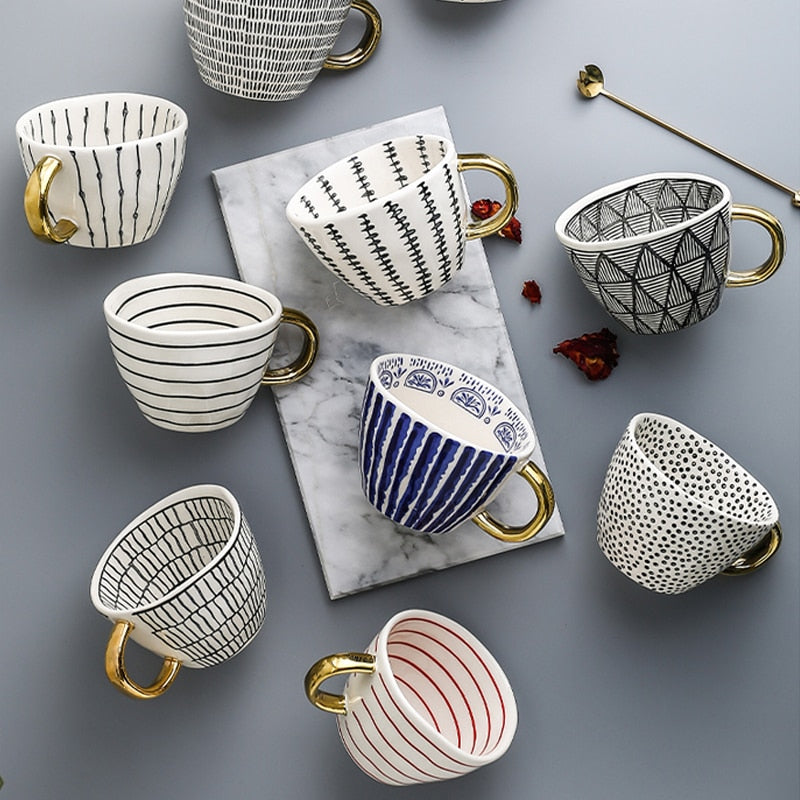 Siopsrl| Cup with abstract geometric pattern and gold handle