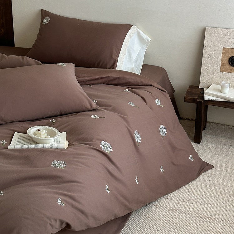 Embroidered bed linen set made of cotton satin with subtle scattered flower embroidery