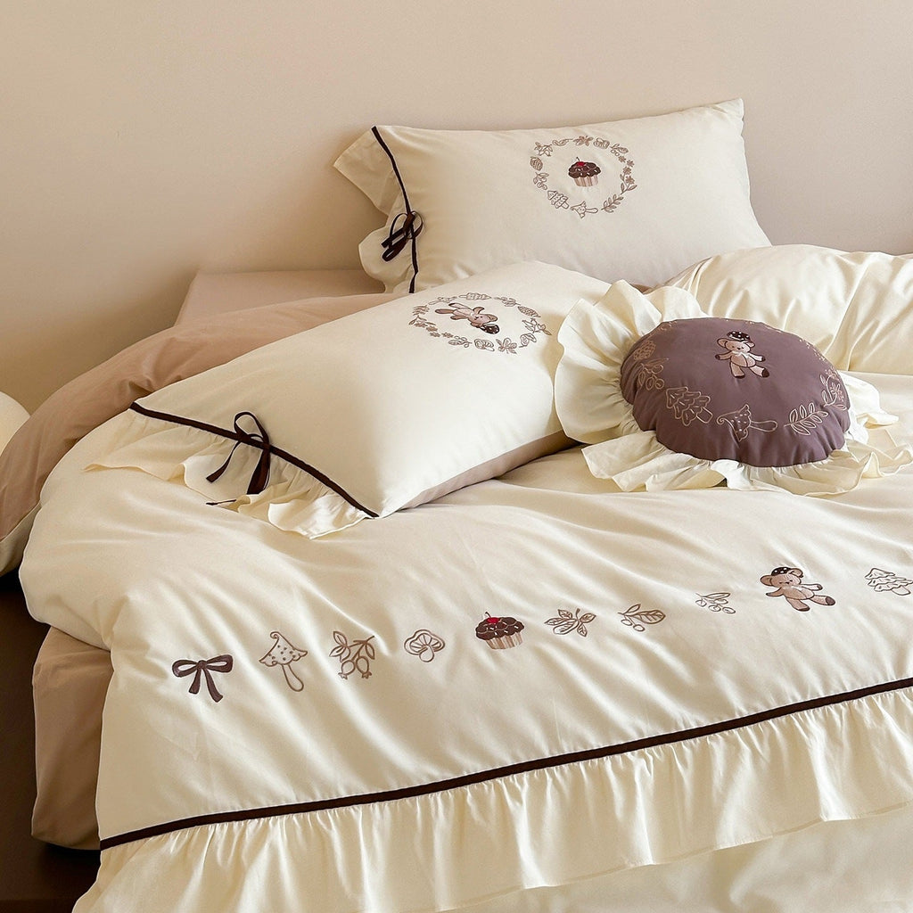 Embroidered bedding set with ruffled trim, teddy design and decorative pillow