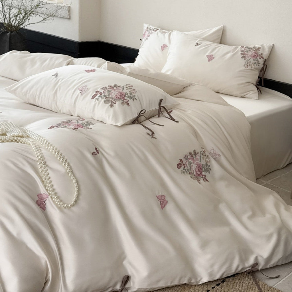 Fine satin bedding set with floral embroidery, tie ribbons and fine quilted texture Bowlift