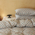 Cotton satin bedding set with fine check pattern and floral motifs
