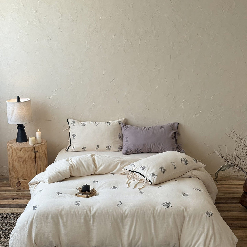 Breathable cotton-linen bedding set with delicate floral embroidery and bow closure