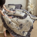Microfleece bedding set with floral velour relief and decorative trim