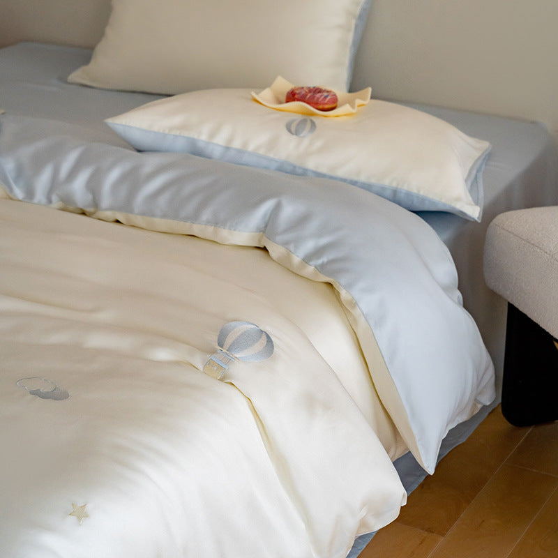 Luxurious satin bedding set with embroidered cherry motifs, reversible function and plush bunny pillow