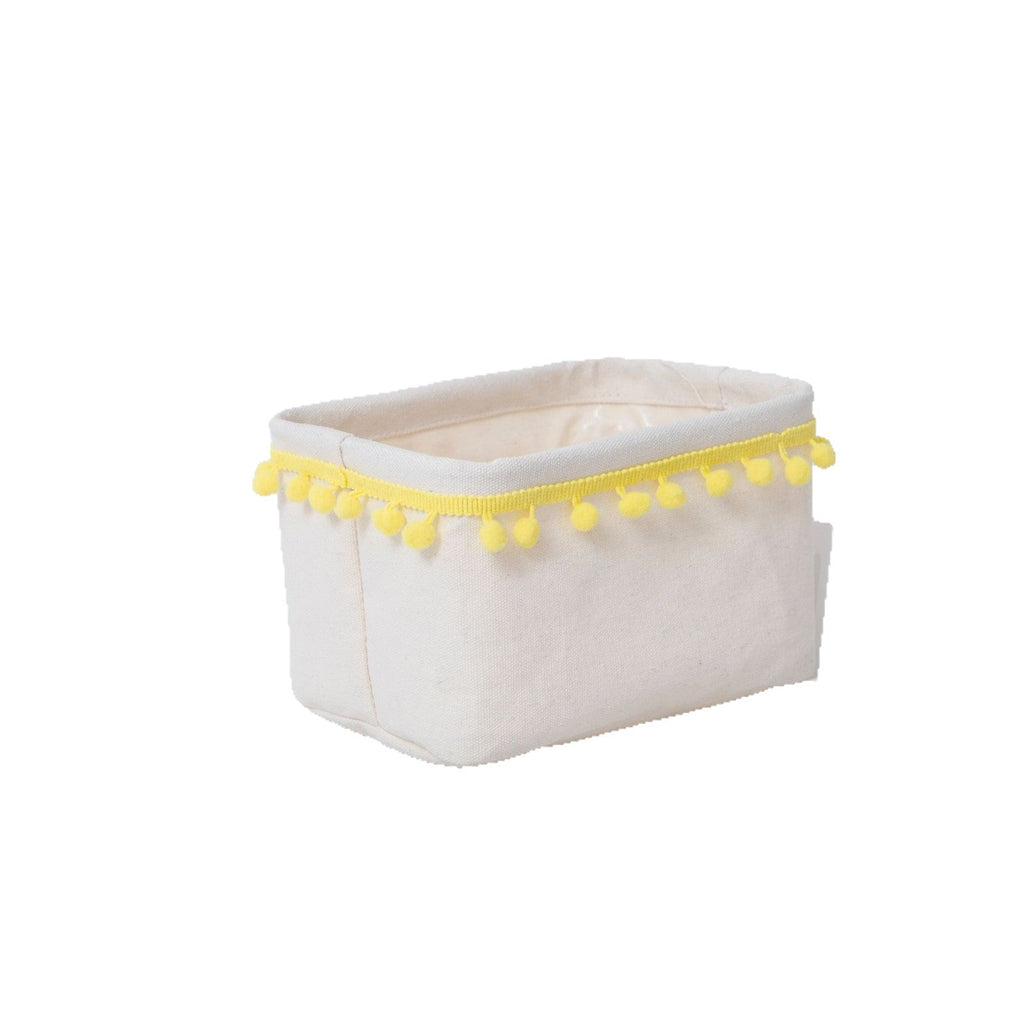 Storage basket with decorative pom-pom trim