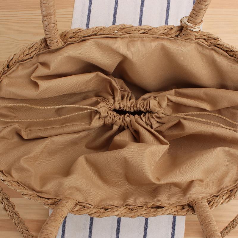 Siopsrl | Handbag made of braided natural material with elegant tassel decoration Siopsrl