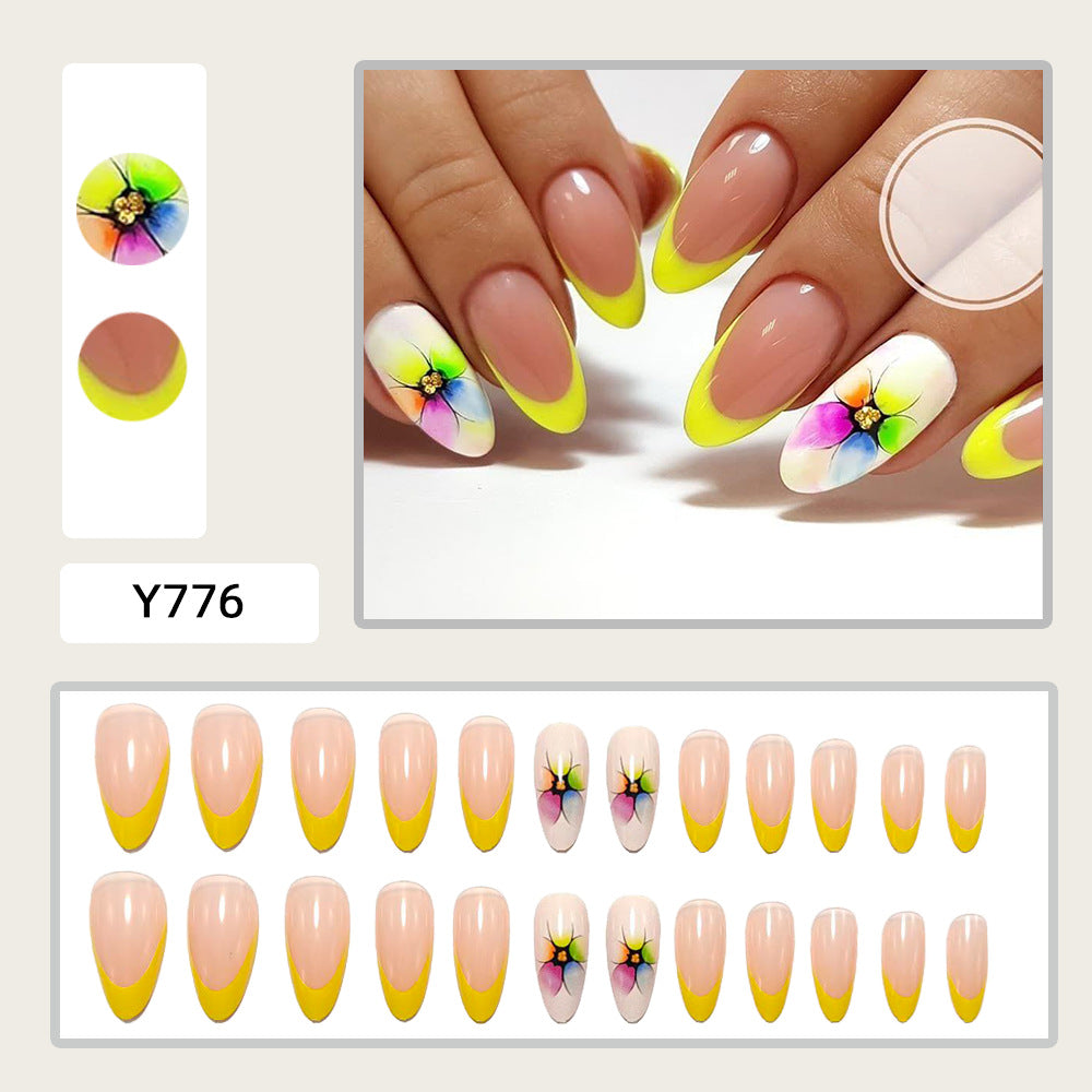 Siopsrl | Stylish artificial nails with floral accents and colorful French tip design Siopsrl