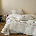 Embroidered cotton satin bedding set with lace trim