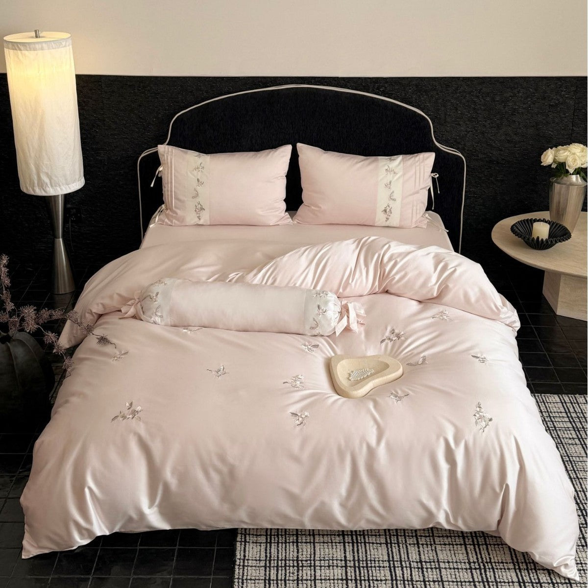 Luxurious satin bedding set with embroidered floral appliqués and bolster Bowlift