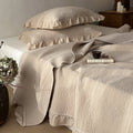 Quilted cotton bedspread and pillowcase set with ruffled edge