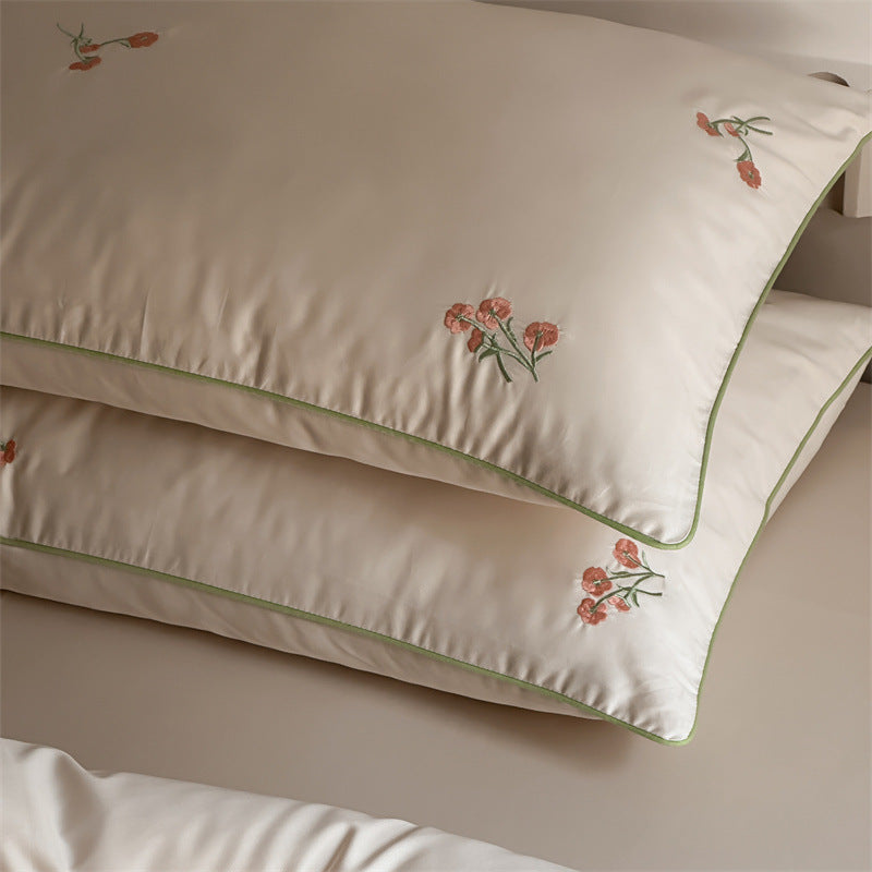 Luxurious cotton satin bedding set with delicate floral embroidery and a silky-matte surface