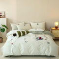 Embroidered cotton bedding set with Christmas tree and wreath emblems