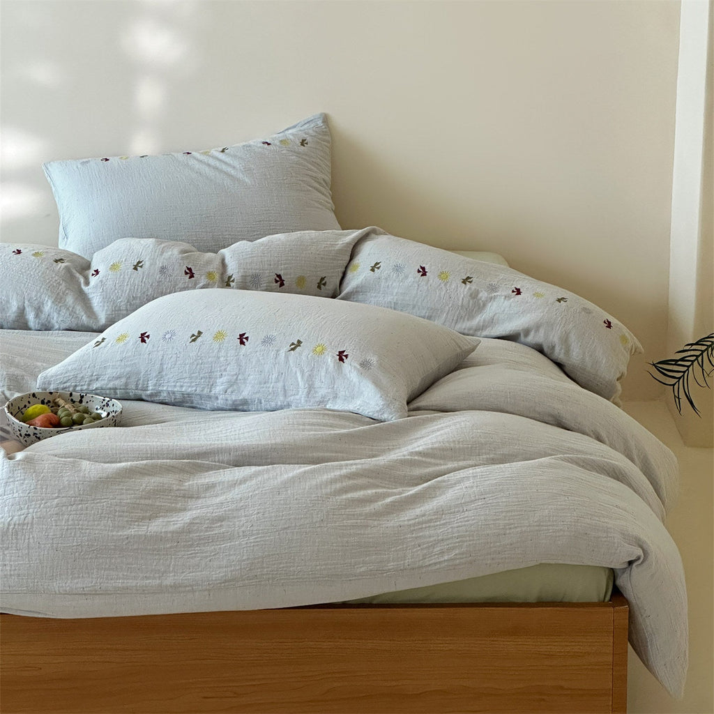 Bedding set in linen look with subtle embroidered border
