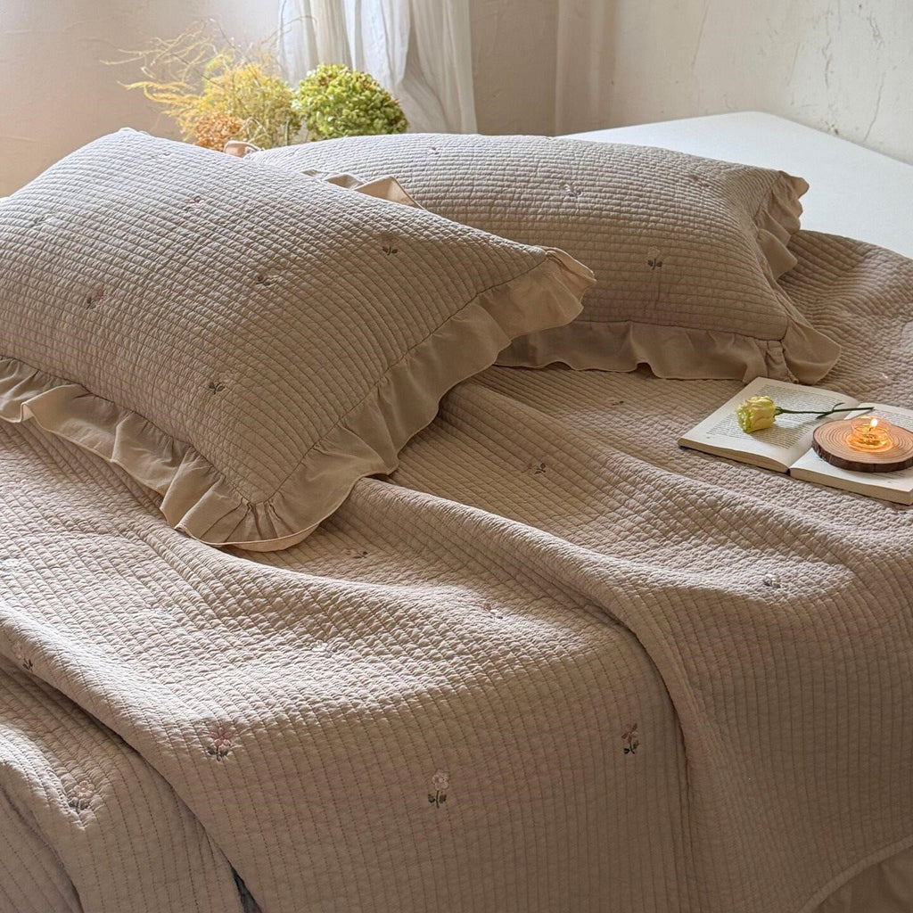 Quilted bedspread and cushion set with frill and delicate flower embroidery