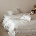 Luxurious cotton satin bed linen set with fine lace border