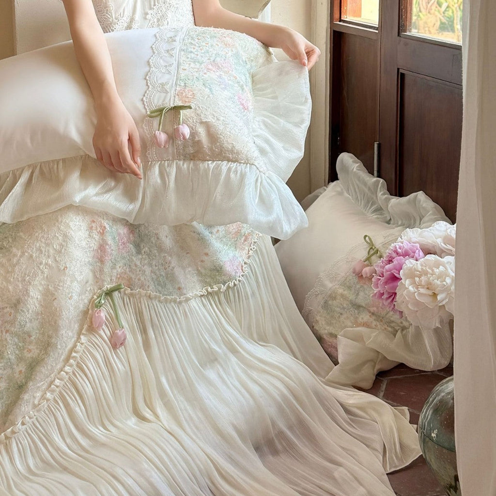 Romantic bedding set with ruffled frill, embroidered decorative pillows, and flowing pleated bedspread Bowlift