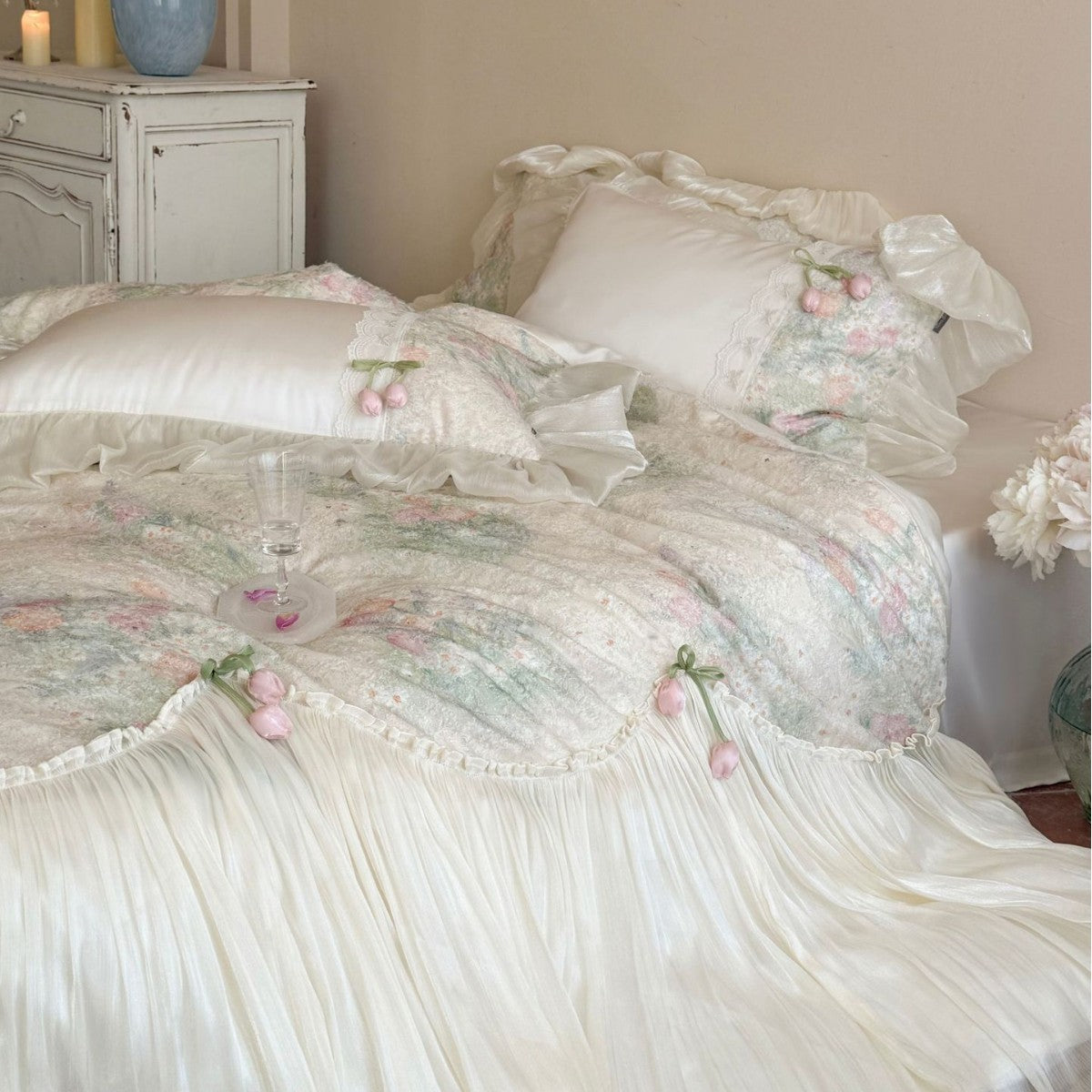 Romantic bedding set with ruffled frill, embroidered decorative pillows, and flowing pleated bedspread Bowlift