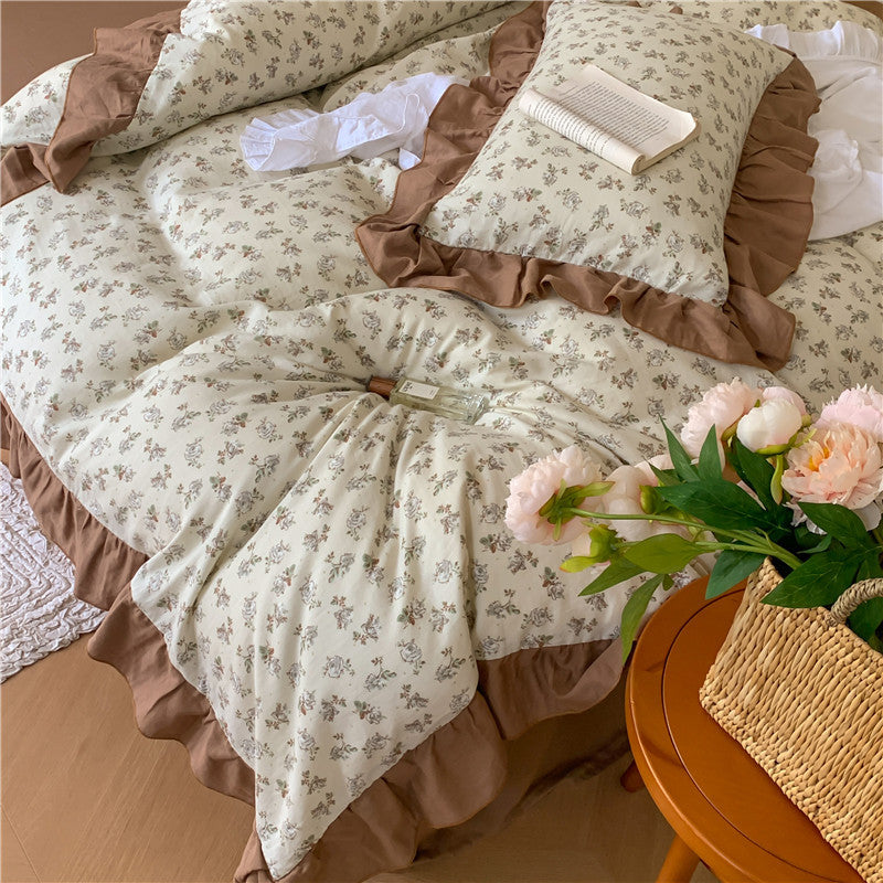 Romantic bed linen complete set made of cotton percale with delicate floral print, ruffle trim, and silky-matte finish