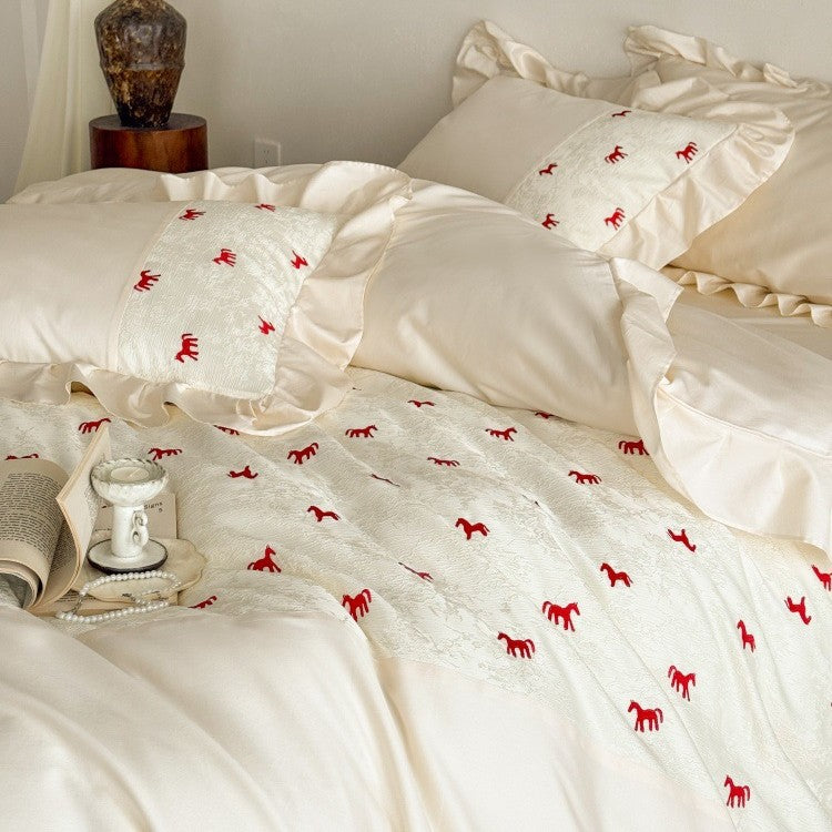 Romantic cotton satin bed linen set with ruffle, decorative panel and delicate animal print Bowlift