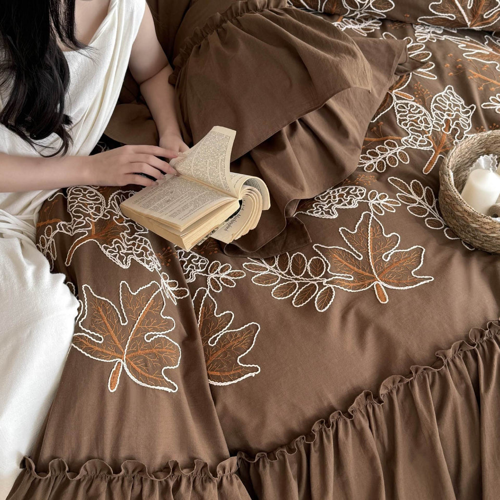 Bedding set with embroidered leaf pattern, ruffled bed skirt and ruffled pillow