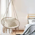 Boho macrame hanging swing chair with faux fur cushion and fringe Siopsrl