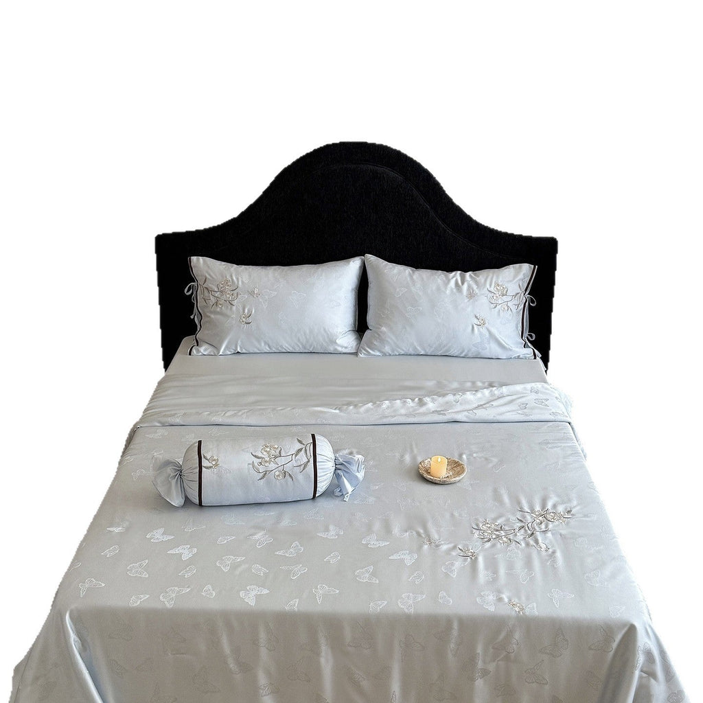 Light jacquard satin bed linen set with embroidered butterfly motif and decorative roll Bowlift