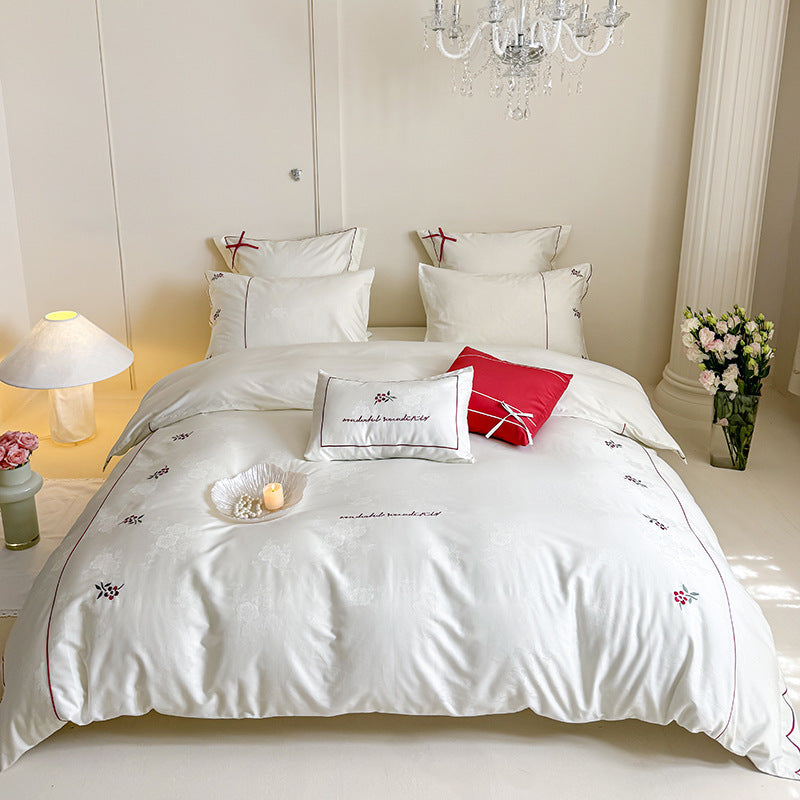 Bedding set with fine embroidery and contrasting piping
