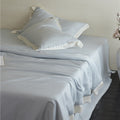 Elegant satin bedding set with silky touch, contrasting border and concealed closure