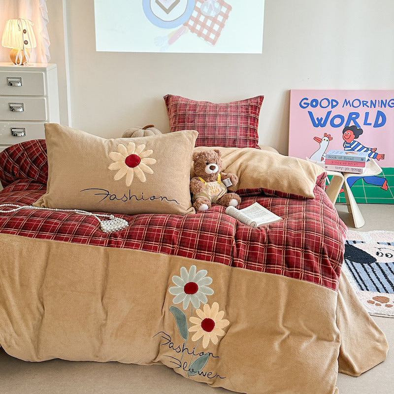 Quilted bedding and throw blanket set with check stitching, velvet texture, and floral appliqué