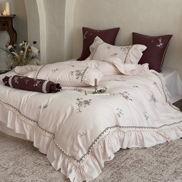 Bedding set made of cotton satin in vintage style with floral embroidery, ruffle and lace trim