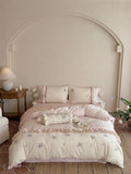 Romantic cotton satin bedding set with ruffles, embroidered flower bouquets, and decorative rolls Bowlift