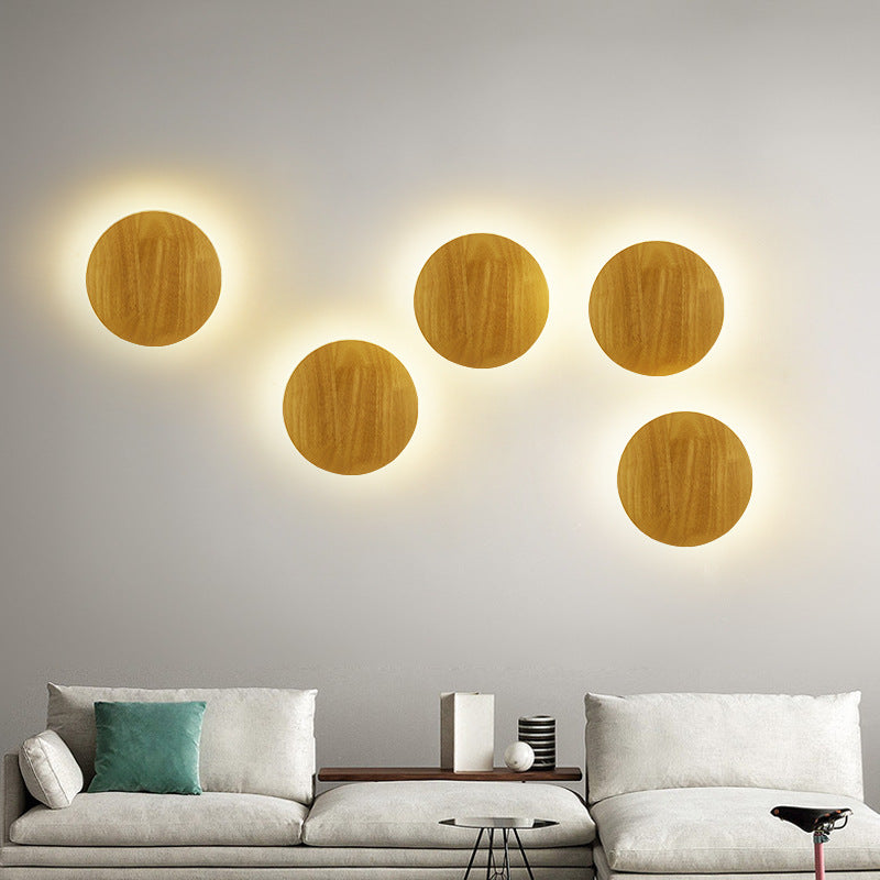 Organic pebble-shaped LED wall sconce solid wood face warm ambient backlight Siopsrl