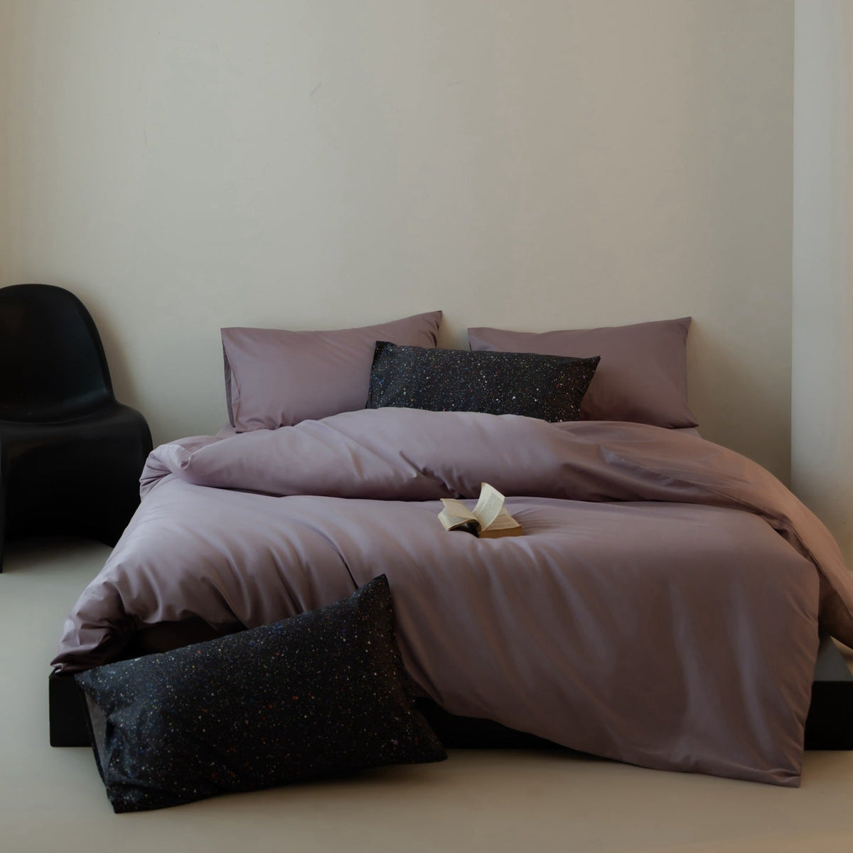 Luxurious cotton satin bedding set with contrasting patterned pillows