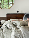 Reversible cotton satin bedding set with fine bamboo print and pillowcases with tie bands