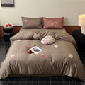 Luxurious cotton satin bedding set with embroidered strawberry appliqués