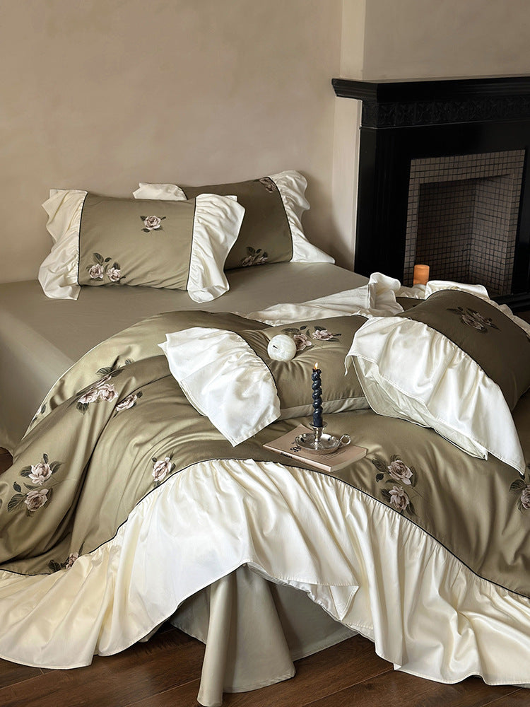 Luxurious satin bedding set with floral embroidery and frills