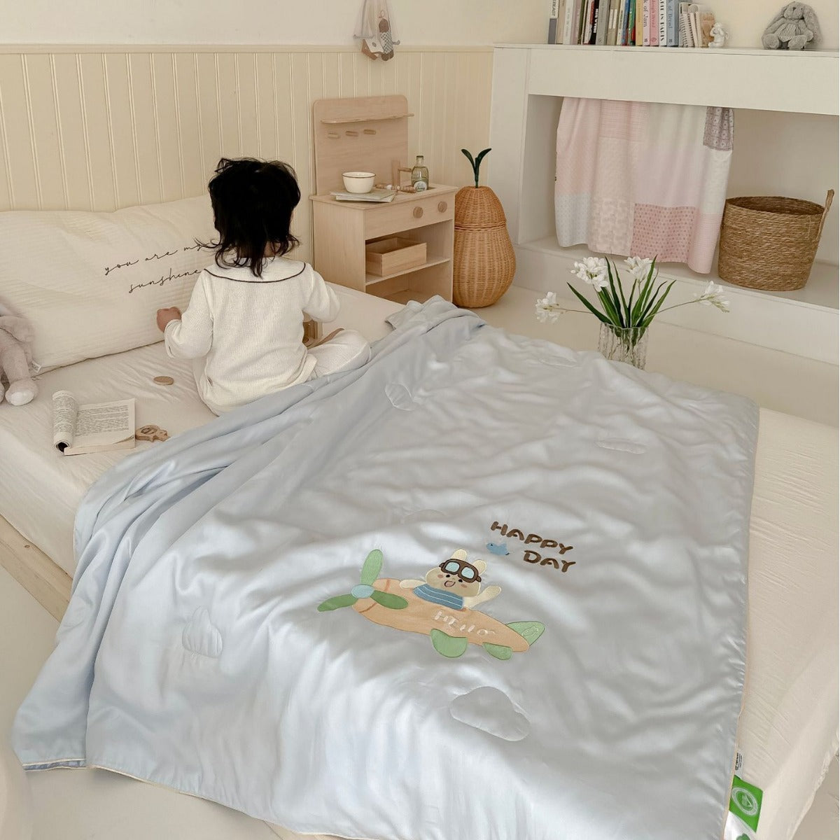 Children's comfort quilt with sweet bunny embroidery and silky satin cover