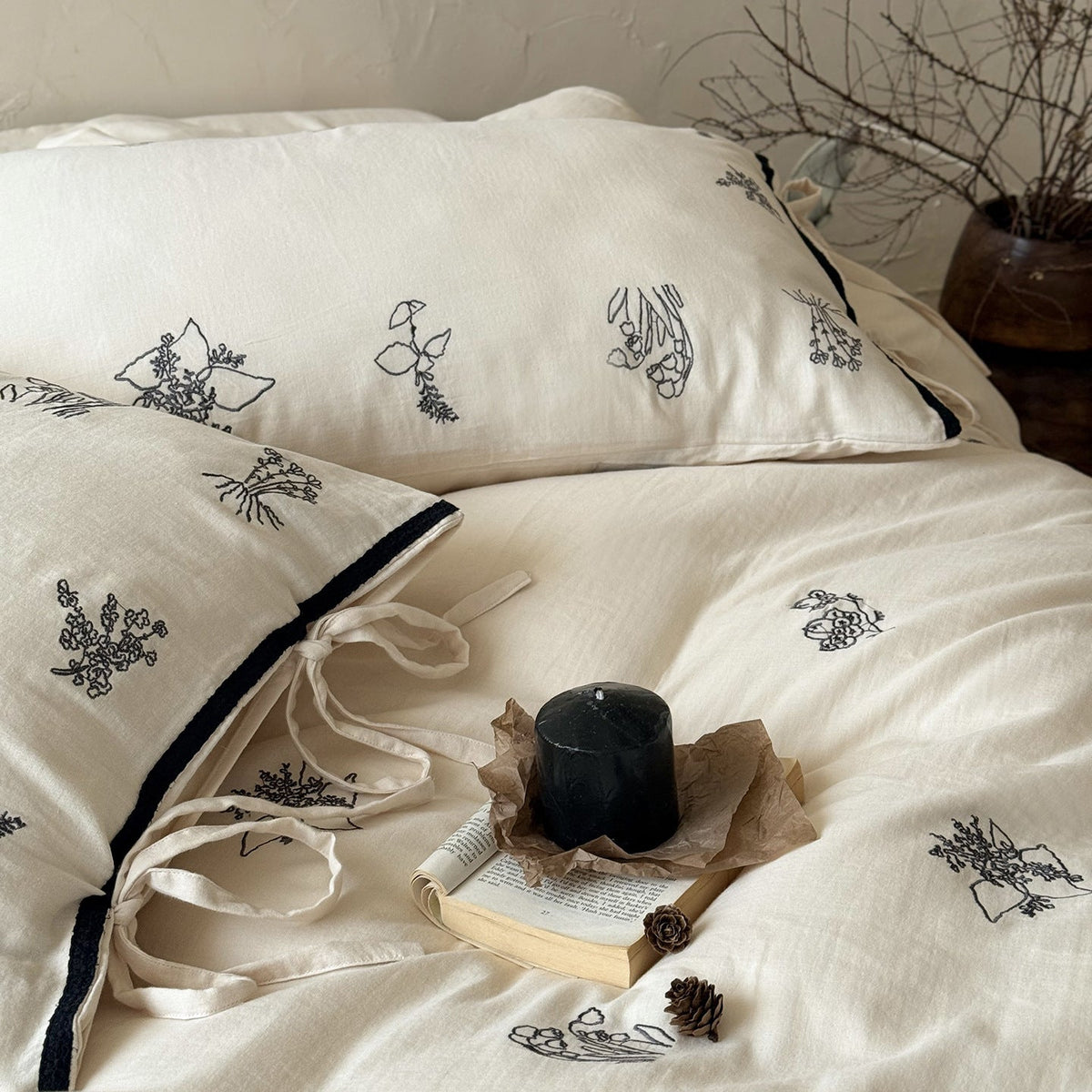 Breathable cotton-linen bedding set with delicate floral embroidery and bow closure