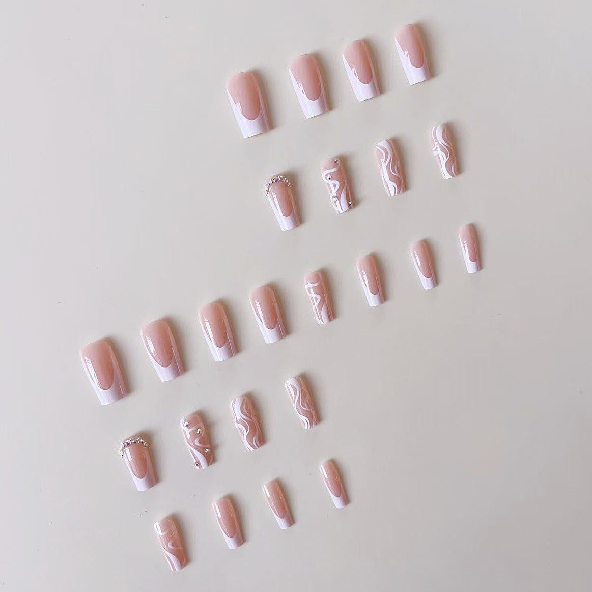Siopsrl | Artificial nail set with elegant French design and creative accents Siopsrl