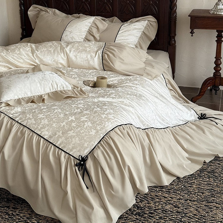 Romantic bed set with frill, jacquard relief and decorative ribbon