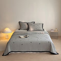 Quilted cotton bedspread set with heart motif and contrasting piping Bowlift