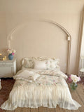 Romantic bedding set with ruffled frill, embroidered decorative pillows, and flowing pleated bedspread Bowlift