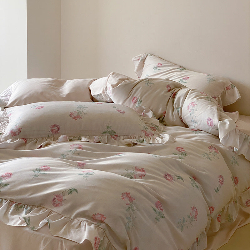 Luxurious satin bedding set with delicate rose pattern and ruffled hem