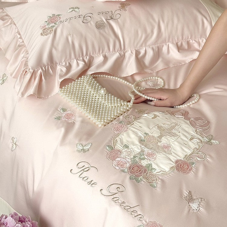 Delicate embroidered cotton satin bedding set with ruffle, satin trim, and rose motif