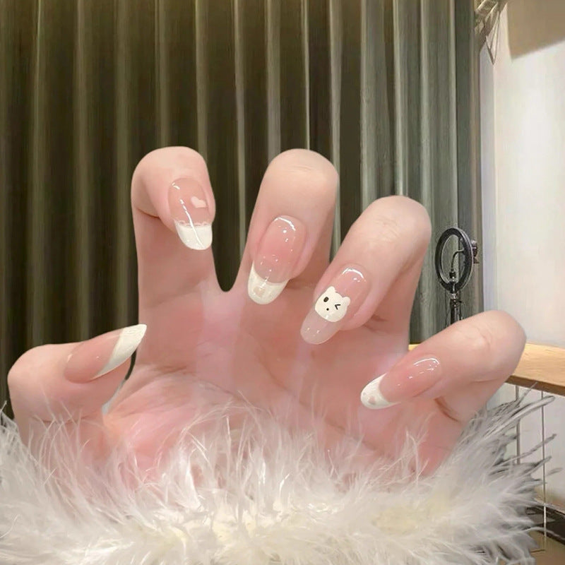 Siopsrl | Artificial nails with playful animal motif and elegant French tip design Siopsrl