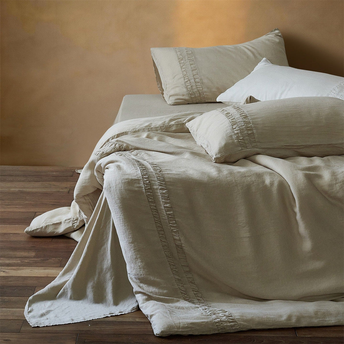Linen bedding set with stonewash finish and delicate ruffle inserts